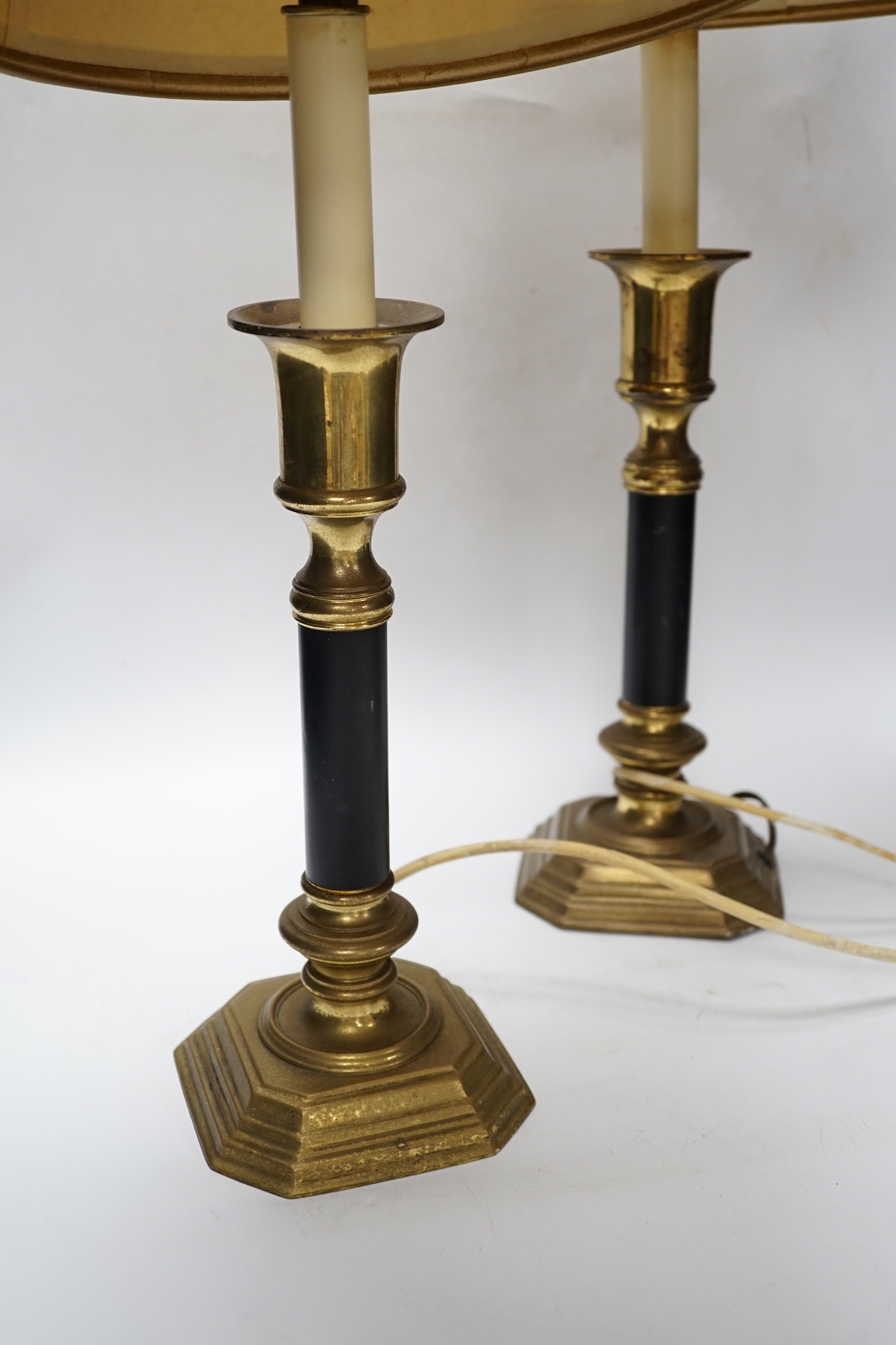 A pair of brass and black table lamps and shades, 64.5cm high